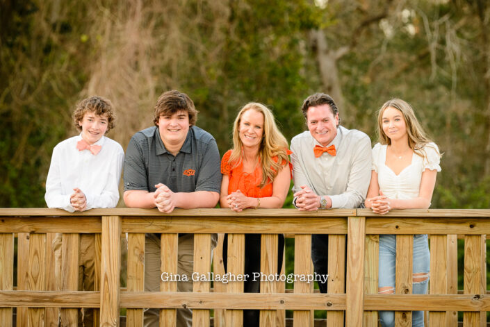 OSU Bound Senior and his family leaning on a rail